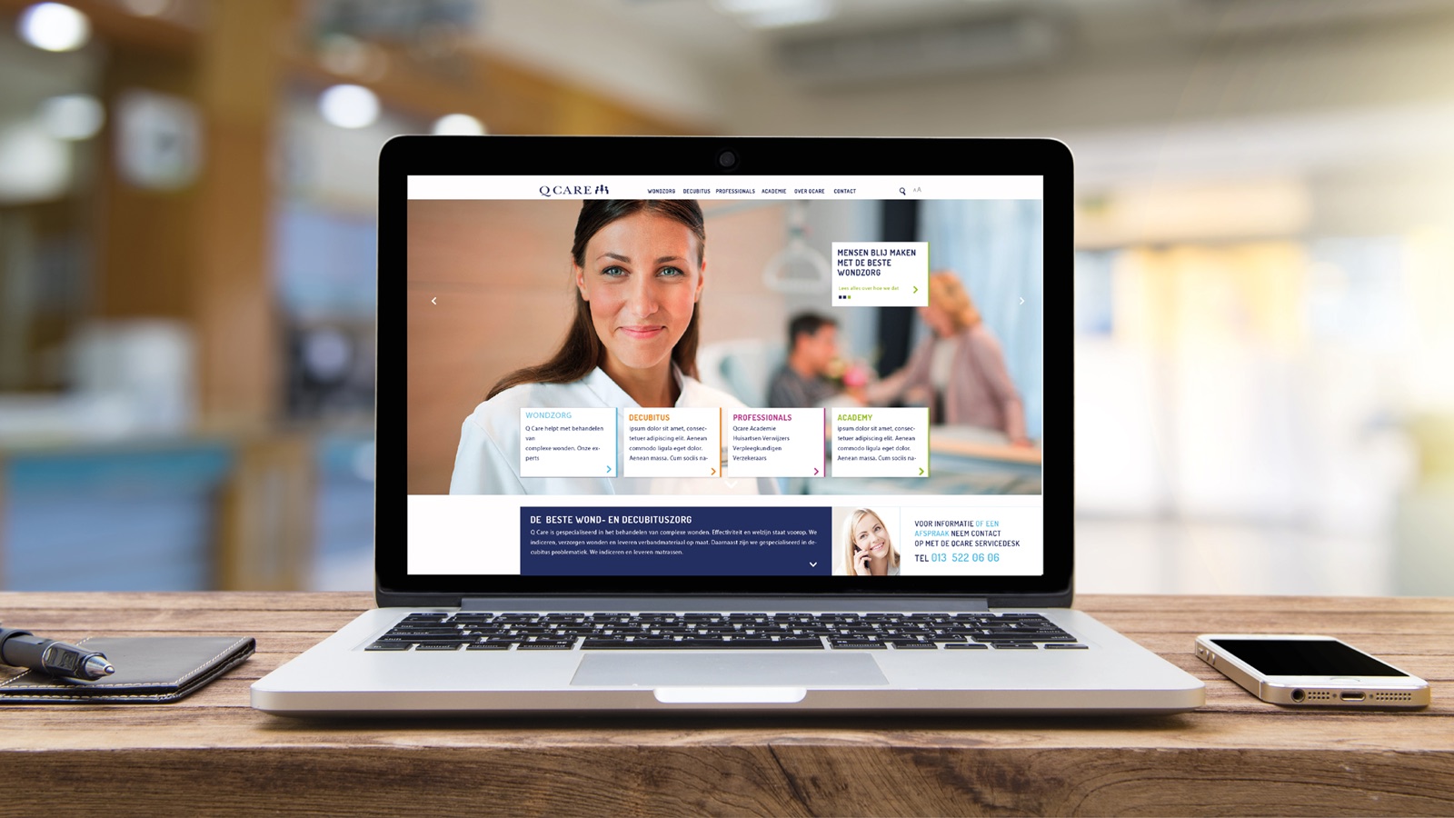 The new Q Care website on a laptop on a desk